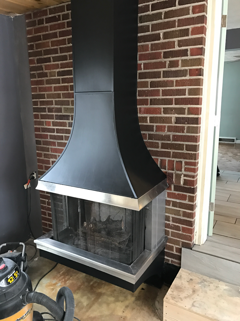Fireplace in the breezeway that connects the garage to the house.